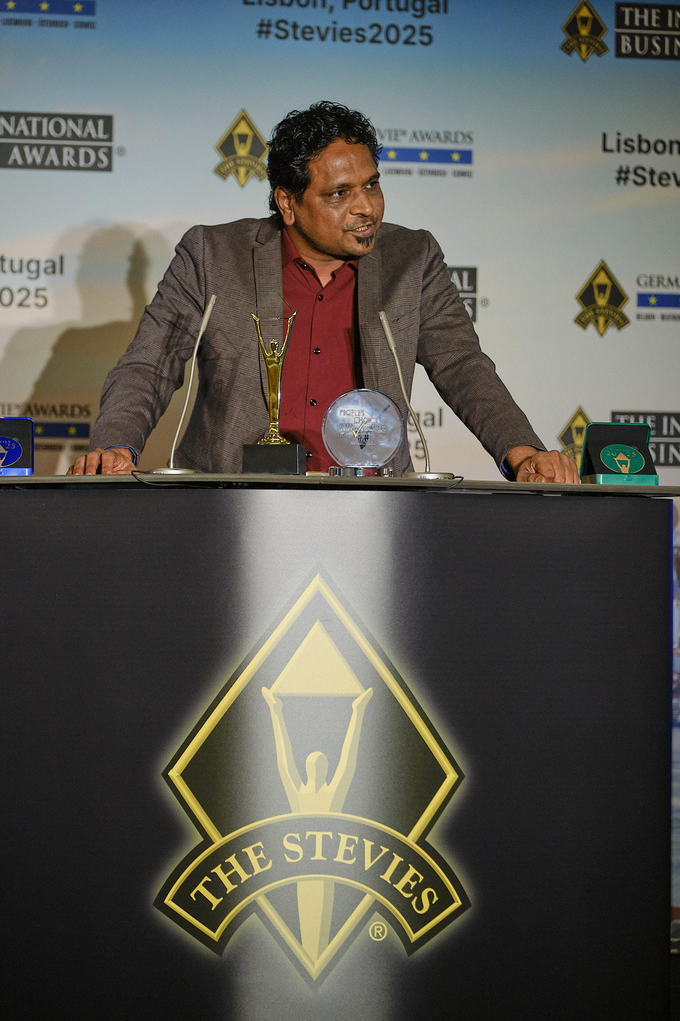 Chirag Patel giving acceptance speech at Stevie Awards ceremony in Lisbon, Portugal 2025